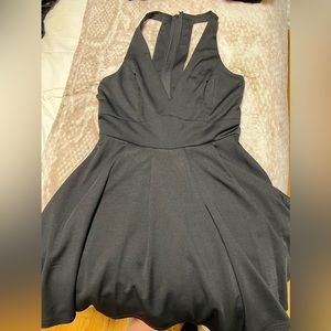Black fit and flare dress with back detail.